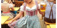 Woman Wearing Traditional Dirndl Dress at Oktoberfest Beer Tent